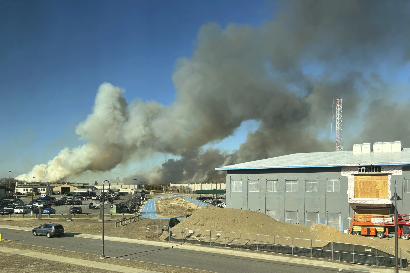 Wind-driven brush fire on New York’s Long Island 50 percent contained. Firefighter injured